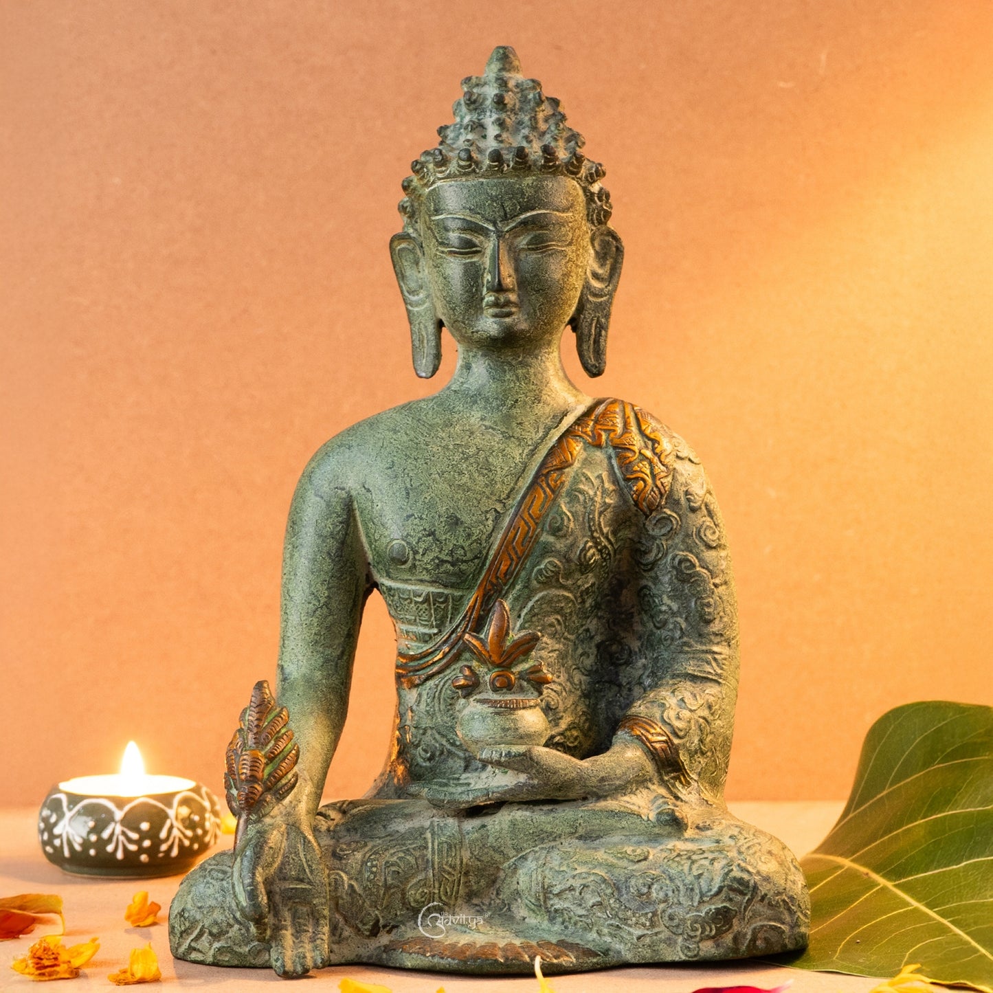 Front view of Brass Tibetan Buddha statue in earthy tones, seated in meditation posture with a calm and grounded expression.