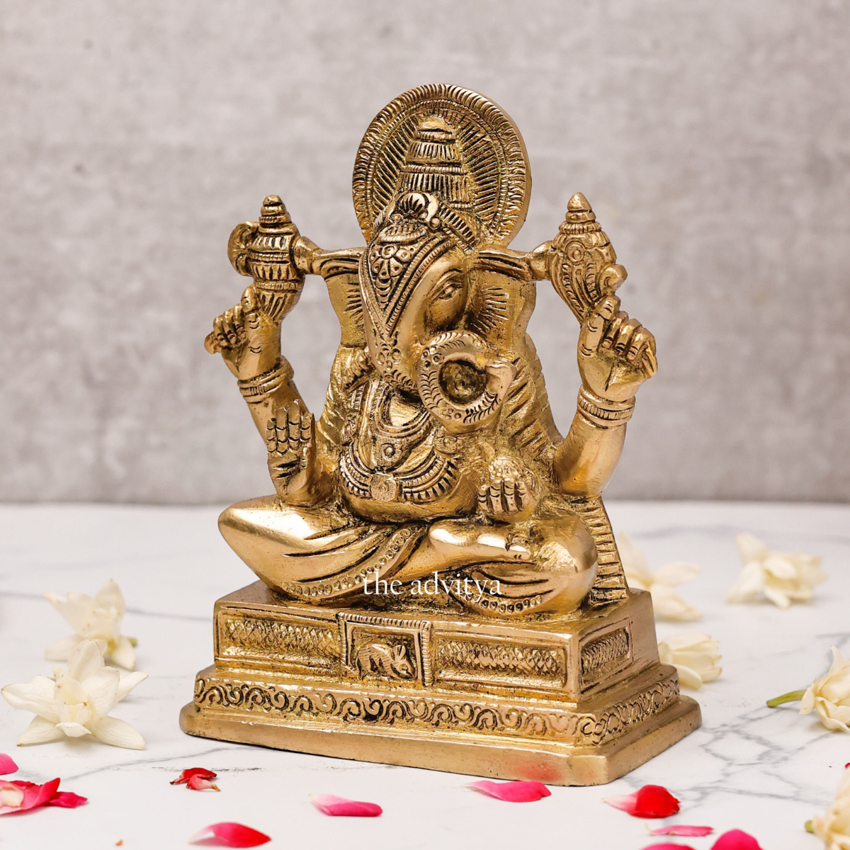 Side view of 6 inch Brass Ganesh Idol Svarup showcasing intricate design and four hands holding Shankh