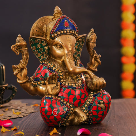 Close-up of Ganesha statue highlighting colorful stonework finish and craftsmanship