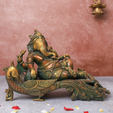Brass Antique Ganesha resting on peacock couch