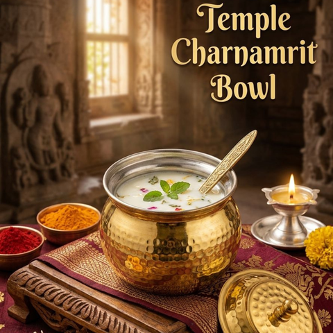 Brass spoon pouring ghee from hammered brass ghee pot