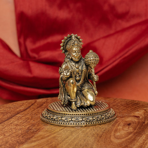 Full length side view of a handcrafted brass Hanuman statue showing detailed ornaments