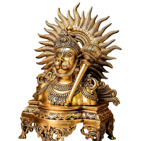 Left angle view of brass Hanuman bust idol with gada highlighting sculpted halo and traditional design with white background.