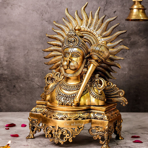 Left angle view of brass Hanuman bust idol with gada highlighting sculpted halo and traditional design