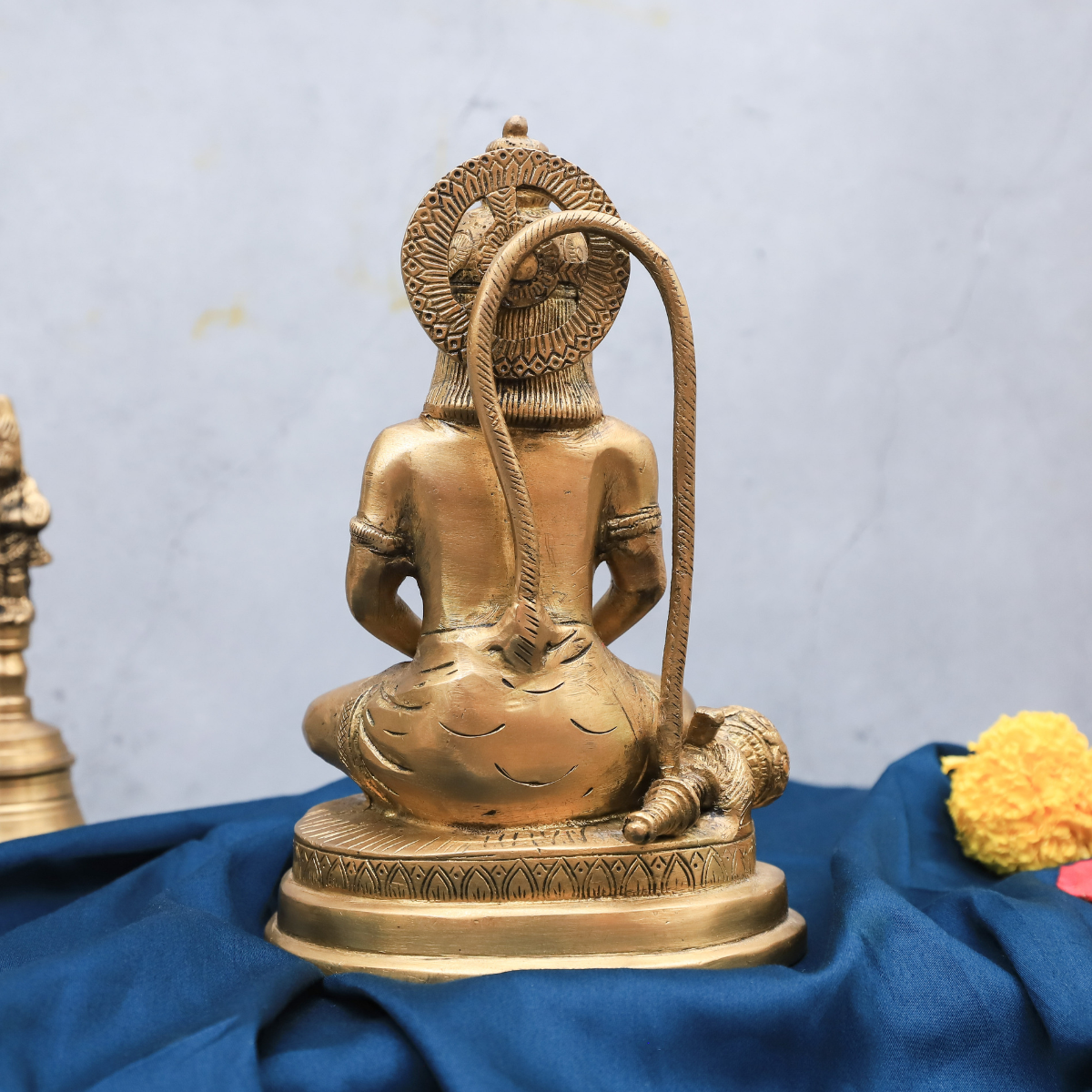 Back view of brass Hanuman statue showing detailed craftsmanship