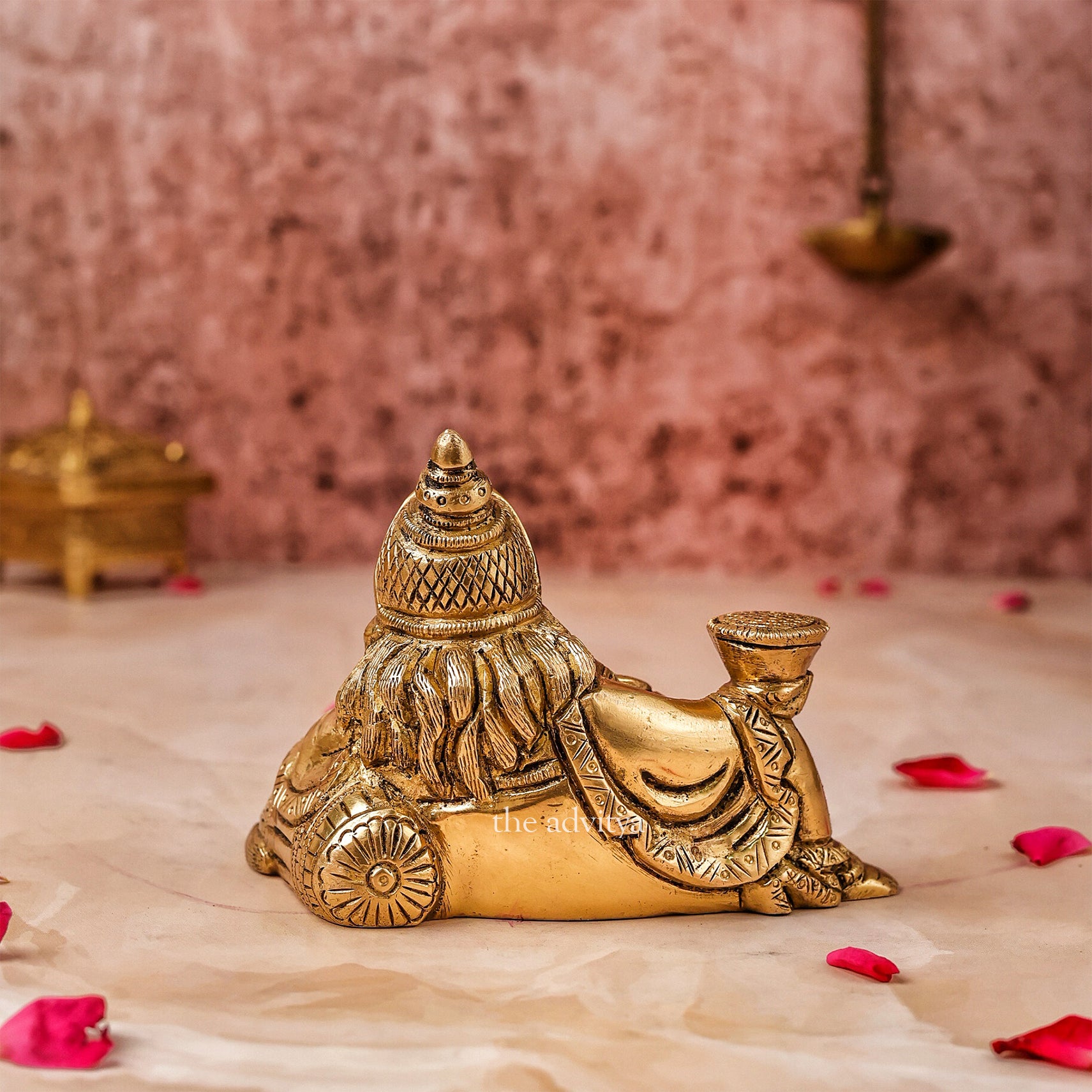 Back view of Kubera Murti reclining form with detailed craftsmanship.