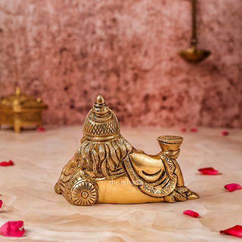 Back view of Kubera Murti reclining form with detailed craftsmanship.