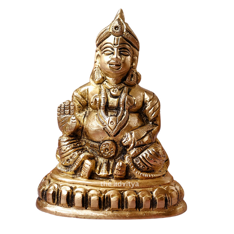 Kubera Statue sitting on a base, front view symbolizing wealth.