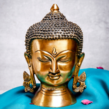 Large brass Buddha head displayed as elegant and peaceful home décor
