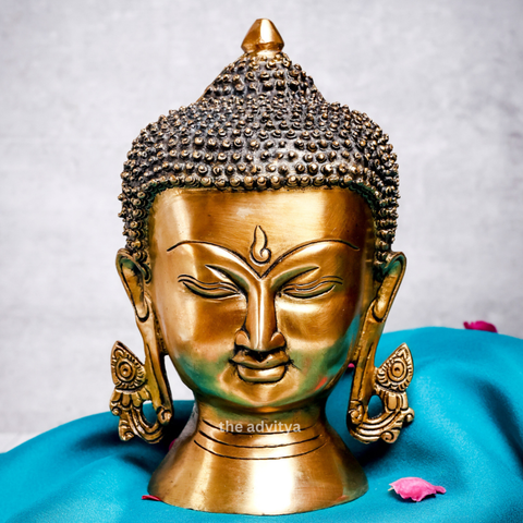 Large brass Buddha head displayed as elegant and peaceful home décor
