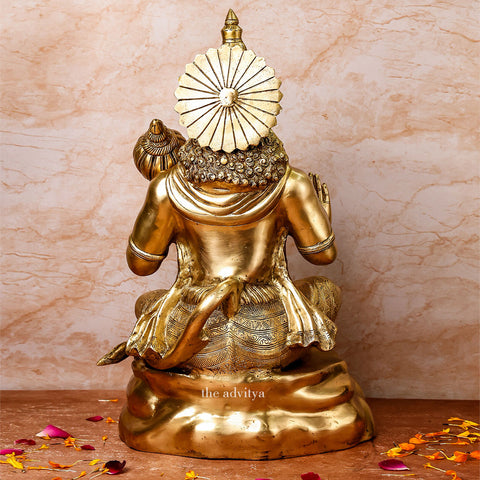 Back view of large brass Hanuman statue sitting posture with detailed craftsmanship