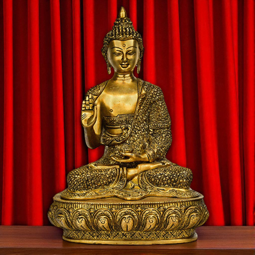 Front view of large brass sitting Buddha statue on ornamental base