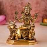 Front view of Lord Shiva idol with Nandi showing seated posture and blessing hand.