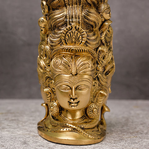 Antique brass Lord Shiva statue with 3 faces behind Parvati for home temple.