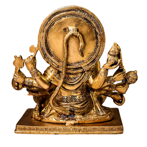 Back view of brass Panchmukhi Hanuman idol showing traditional craftsmanship with white background.