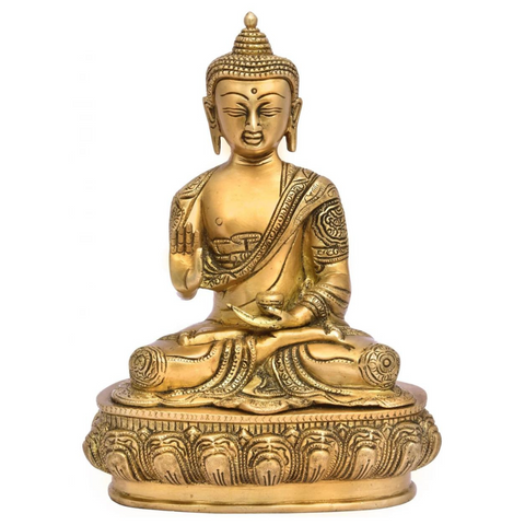 Close-up of peaceful Buddha brass statue focusing on the tranquil face, crown detailing, and meditative expression.