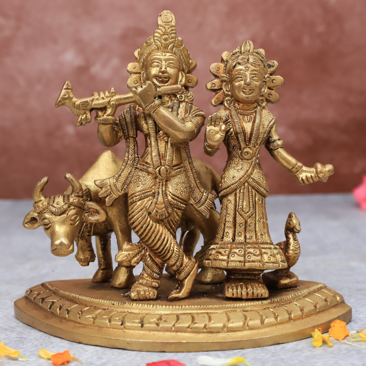 Front view of Radha Krishna statue with cow on same base for home temple and spiritual decor.