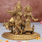 Front view of Radha Krishna statue with cow on same base for home temple and spiritual decor.