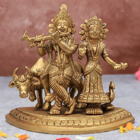 Front view of Radha Krishna statue with cow on same base for home temple and spiritual decor.