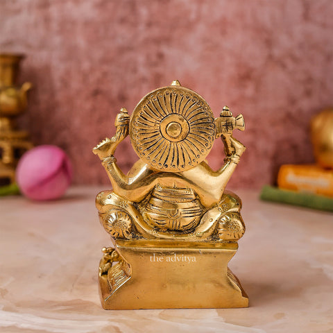 Back view of Raja Ganesha brass idol with smooth brass finish.