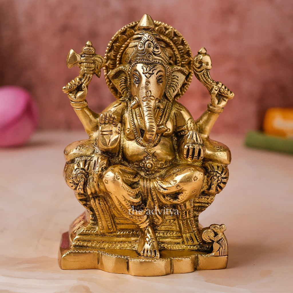 Close-up of Raja Ganesha brass statue highlighting facial detailing and craftsmanship.