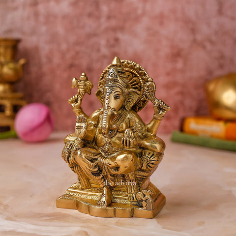 Side angle of 5 inch Raja Ganesha brass statue showing royal posture.