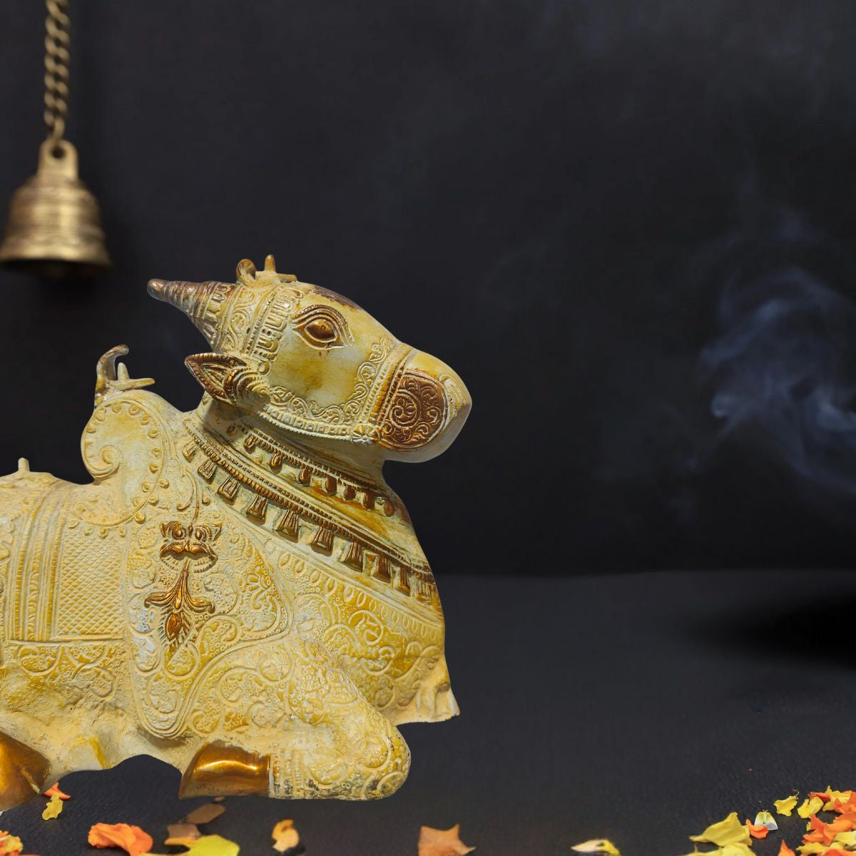 Brass Nandi idol with sand finish and golden tone.