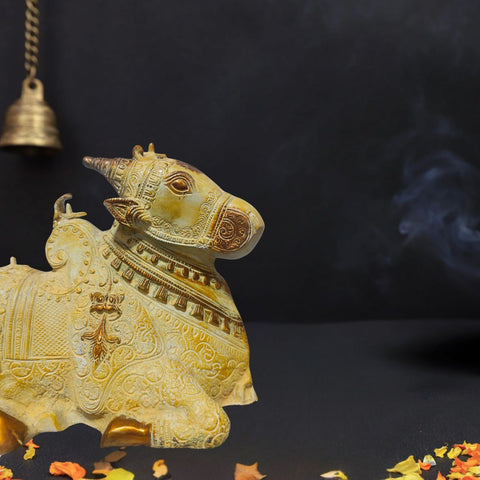 Brass Nandi idol with sand finish and golden tone.
