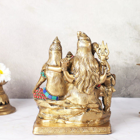 Back view of brass Shiv Parivar Statue showing sculpted stone work finish.