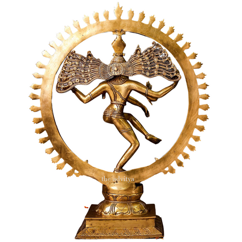 Back view of a brass Nataraja Shiva statue showing detailed wings and body posture.