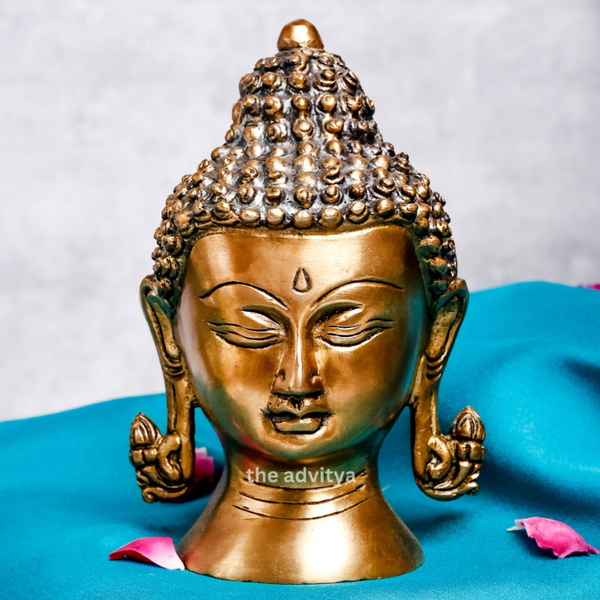 Close-up view of a small Buddha head highlighting fine facial details