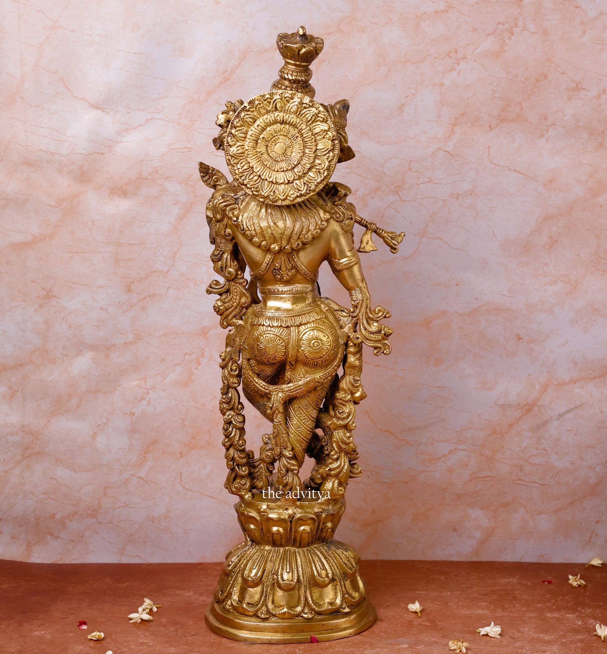 Standing back view krishna idol.