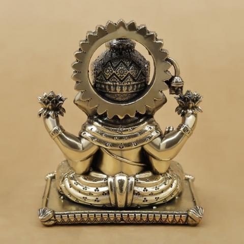 Back view of 4 inch brass Ganesha statue showing fine detailing and polished finish