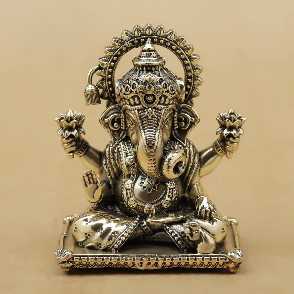 Front view of super fine 4 inch brass Ganesha statue with detailed craftsmanship.