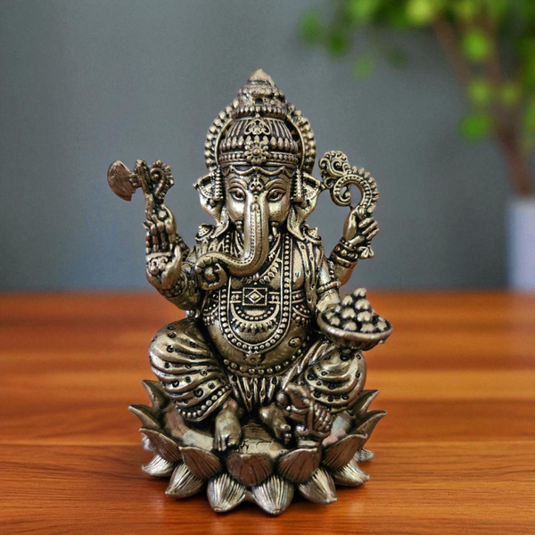 Front view of super fine brass Ganesha statue with detailed craftsmanship.