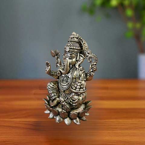 Left angle view of super fine brass Ganesha statue showing fine carving details.