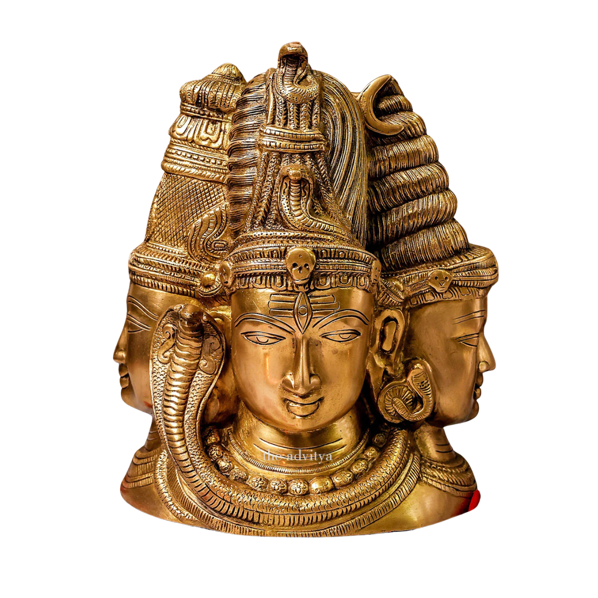 Close-up detailing of Three Face Shiva idol behind Parvati.