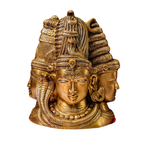 Close-up detailing of Three Face Shiva idol behind Parvati.