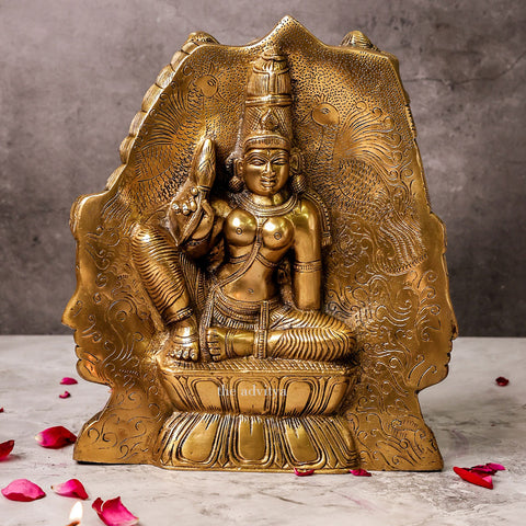 Side angle view of Three Face Shiva idol positioned behind Parvati.