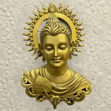 Close-up of Tibetan brass Buddha wall hanging with fine detailing.