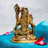Back view of a traditional brass Shiva statue with a seated posture