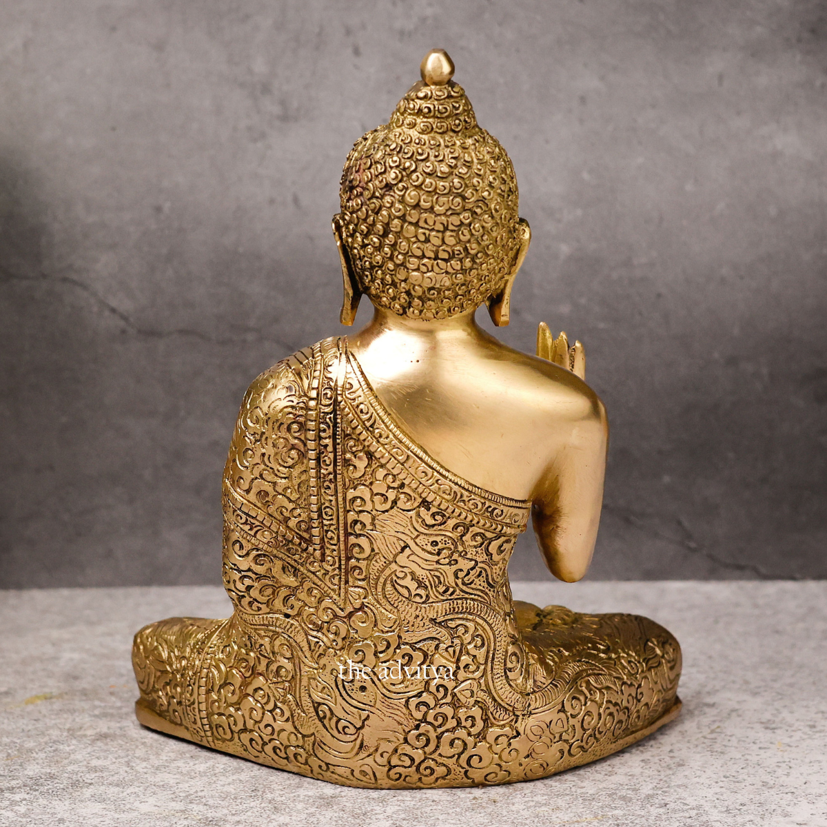 Back view of an authentic brass Buddha statue for Vastu and Feng Shui.