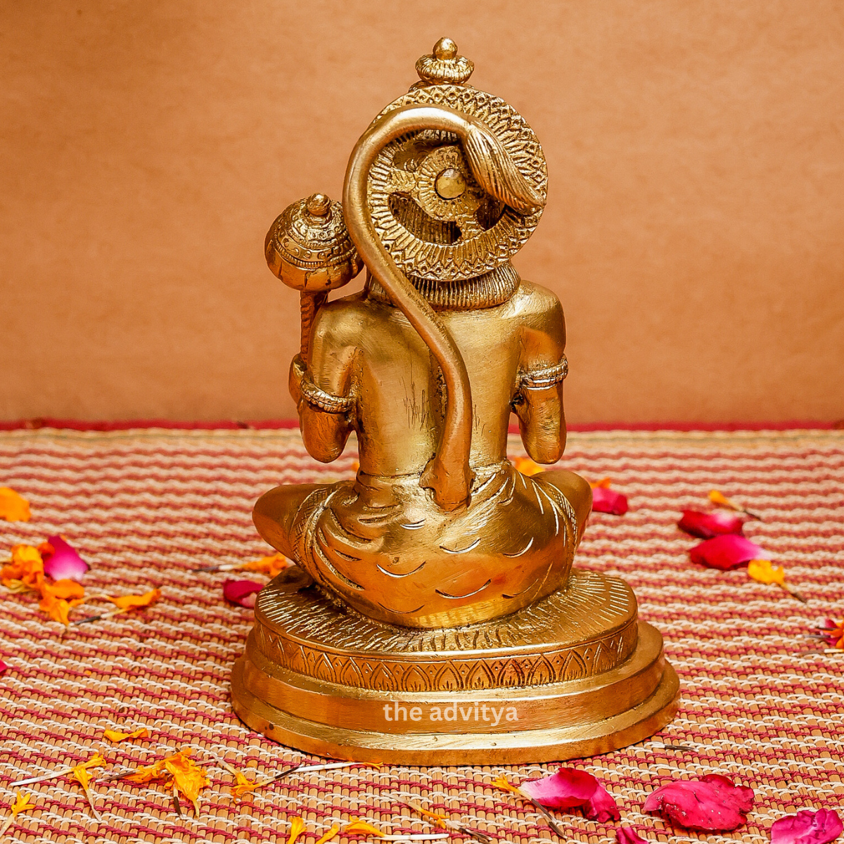Back view of a detailed Brass Hanuman figurine sitting cross-legged with Gada, showing intricate carvings.
