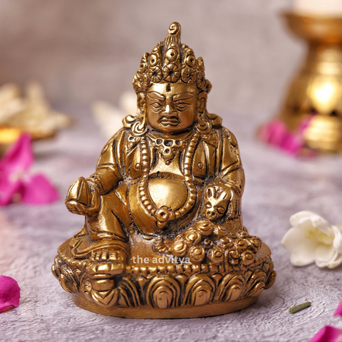 Brass Kubera Statue sitting on a base, front view for home and office prosperity.