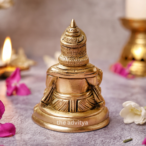 Back view of the Kubera Statue sitting on a base showing detailed finishing.