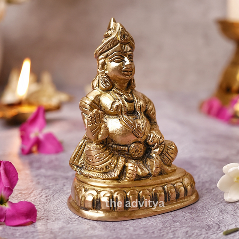 Kubera Statue sitting on a base, right angle ideal for home temple decor.