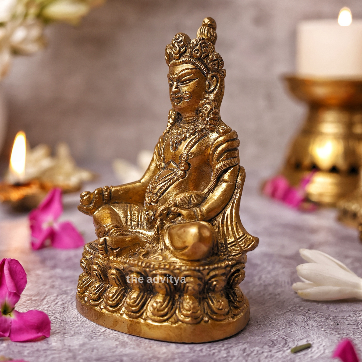 Left side angle of the Sitting Lord Kuber Idol with traditional detailing.